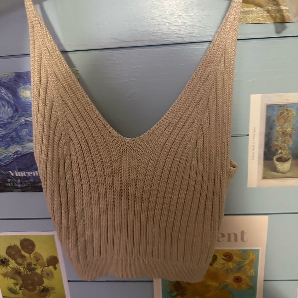 SHEIN brand tank top… for being SHEIN it’s very good quality. NEVER WORN size M